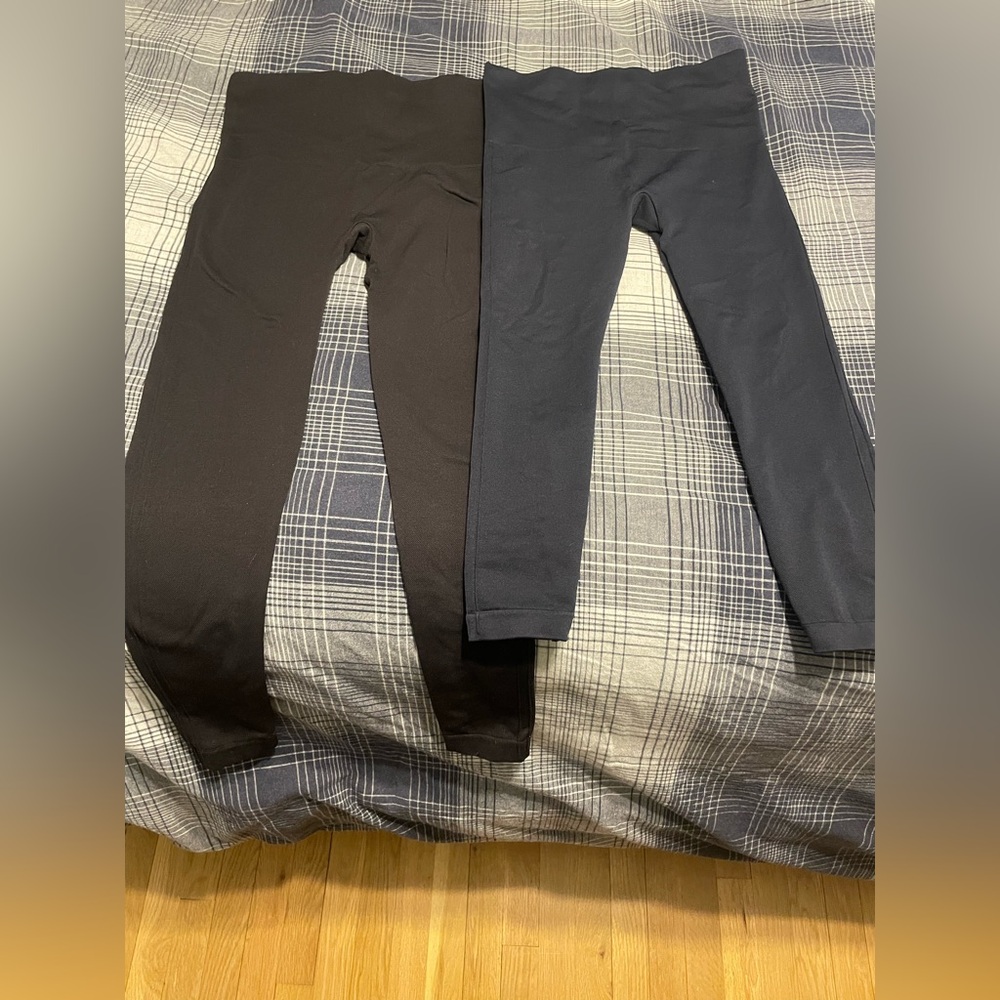 Two pairs of Spanx, brand new. One black, one navy blue.